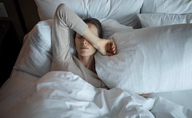 Person resting in a bed